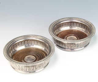 A pair of silver plated pierced wine coasters 15cm 