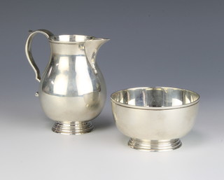 A silver cream jug with sparrow beak spout and S scroll handle together with a sugar bowl, London 1969, 325 grams