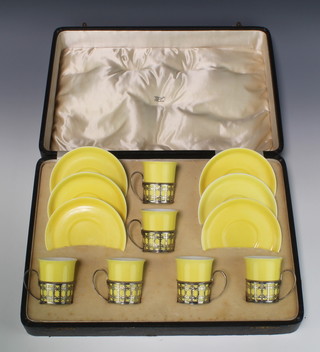 A cased Shelley Late Foley yellow coffee set comprising 6 coffee cans and 6 saucers with pierced silver mounts, Birmingham 1914, cased 