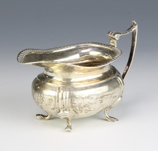 A Victorian silver cream jug on hoof feet, Sheffield 1899, maker James Deakin & Sons 107 grams