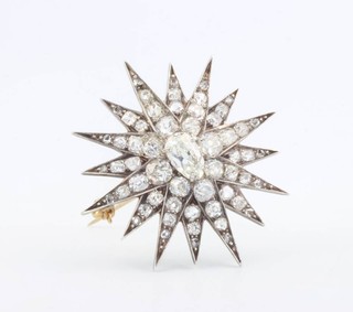 A Victorian diamond set star brooch, the centre pear shaped stone 1.09ct surrounded by brilliant cut diamonds 4ct, 35mm