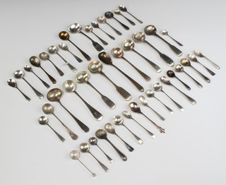 A quantity of Victorian and later silver salt and mustard spoons, 295 grams