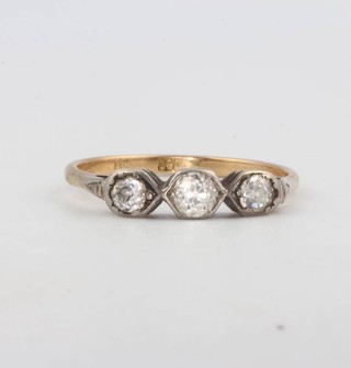 An 18ct yellow gold 3 stone diamond ring size S 1/2