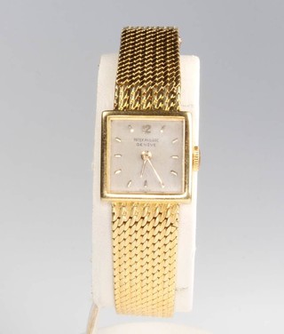A lady's 18ct yellow gold Patek Philippe square wristwatch in a 15mm square case with matching bracelet and hidden clasp 
