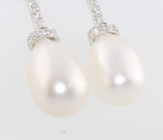 A pair of white gold cultured pearl and diamond ear drops 