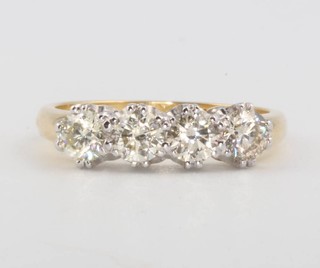 An 18ct yellow gold 4 stone diamond ring 1.2ct, size O 