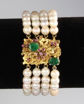 A cultured pearl 4 strand bracelet with 14ct yellow gold clasp set with rubies and emeralds 18.2cm 