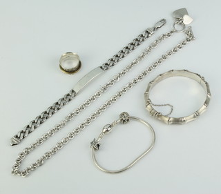 A silver bangle and minor silver jewellery 128 grams 