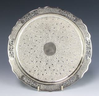 An Indian circular silver salver with floral decoration and pierced rim 330 grams 27cm 