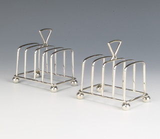 A pair of Sterling silver Sammy 5 bar toast racks on ball feet 115 grams