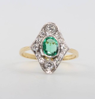 An 18ct yellow gold emerald and diamond cluster ring, size M 