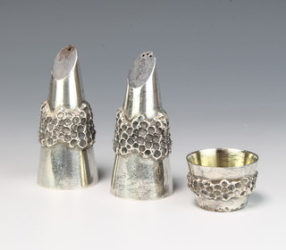 A stylish silver condiment comprising tapered salt and pepper and mustard with cast decoration, London 1972, maker George Grant MacDonald 244 grams 