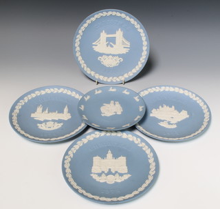 A Wedgwood blue Jasperware Peter Rabbit plate 17cm and 4 other commemorative plates Christmas 1973,4,5, and 8 