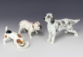 A Royal Doulton figure of a bulldog HN1074 8cm, a do. of a terrier eating from a plate 8cm and a porcelain figure of an English setter 15cm 