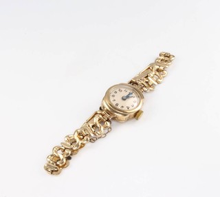 A lady's 9ct yellow gold wristwatch on a gilt bracelet 