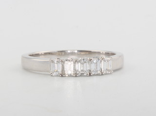 An 18ct white gold 5 stone baguette diamond ring, 0.53ct, size O