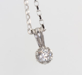A 9ct white gold single stone diamond necklace, 0.25ct, on a 9ct white gold chain 