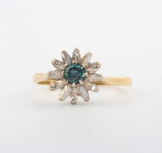 An 18ct yellow gold sapphire and diamond daisy cluster ring, size O 1/2