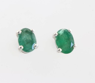 A pair of silver emerald mounted ear studs, 1.4ct 