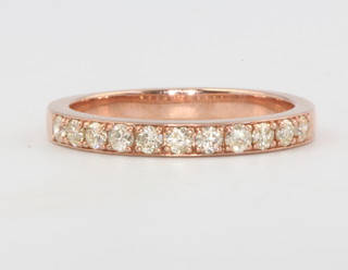A 9ct rose gold diamond half eternity ring 0.35ct, size K 1/2