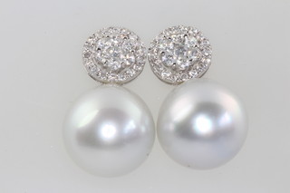 A pair of 18ct white gold Southsea 12mm pearl and diamond drop earrings, approx. 1ct,