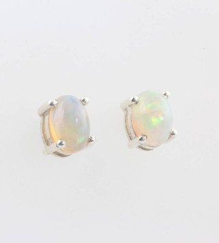 A pair of silver and Ethiopian opal ear studs approx 1.4ct 