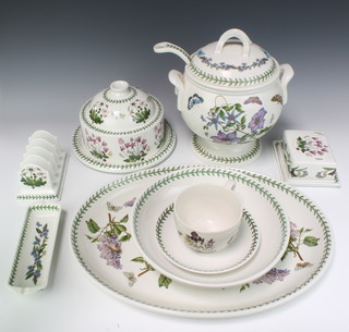 A quantity of Portmeirion Botanic Garden table ware comprising tureen and ladle, cheese dish and cover, oval meat plate, dish, large tea cup and saucer, tray, butter dish and cover and toast rack  