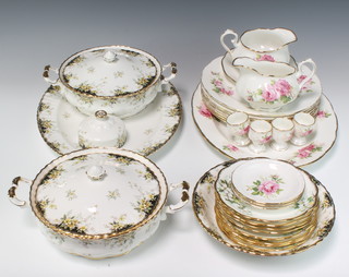 A Royal Albert Royal Ascot part dinner service comprising 2 tureens and covers, meat plate, bowl, bowl lid, a tea plate and 8 Royal Dogwood saucers together with a Royal Albert American Beauty part service with 4 egg cups, 2 sauce boats, 1 sauce boat stand, 3 dishes, 7 dinner plates and a Royal Albert Winsome serving plate, 2 tureens and lids  a pair of Royal Albert Victoriana Rose Tureens and covers and a sandwich plate