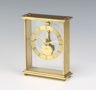 Kaiser, a 1950's West German skeleton clock with gilt chapter ring and Roman numerals contained in a gilt metal case 