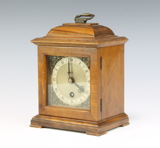 A 1950's Queen Anne style mantel timepiece with gilt dial, silvered chaptering, contained in a walnut case 