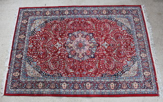 A red and blue ground Bidjar carpet with central medallion within multi-row borders 306cm x 215cm 