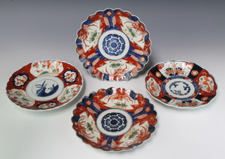A pair of early 20th Century Imari dishes decorated with flowers 22cm two others 