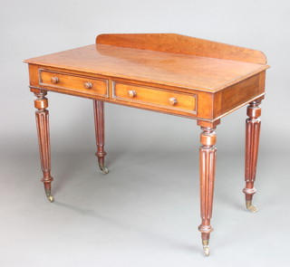 A Victorian plum pudding mahogany side table with raised back, fitted 2 drawers and raised on turned and fluted supports ending in brass caps and casters, the drawer labelled Robert Rough late Thomas Poole & Company, Cabinet Makers and Upholsterers 86cm h x 42cm w x 55cm d 
