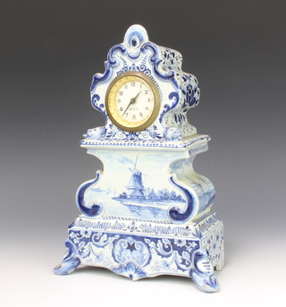 A Delft longcase clock decorated with a windmill, canal scenes and flowers with lion masks and mechanical movement by Meccedes 28cm 