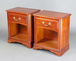 Grange, a pair of Georgian style cherry  bedside cabinets fitted a drawer with brass swan neck drop handles above a recess, raised on bracket feet 60cm h x 53cm x 34cm 