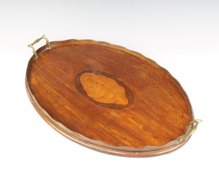 An Edwardian oval inlaid mahogany tea tray, the centre inlaid a shell, 3cm h x 60cm l x 38cm w