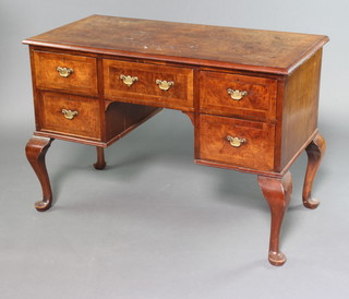 A Queen Anne style figured walnut writing table with quarter veneered and crossbanded top fitted 1 long and 2 short drawers, raised on cabriole supports 66cm h x 111cm w x 53cm d 