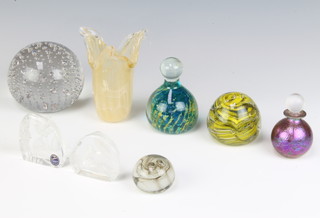A Murano style glass paperweight of globular form 8cm x 5cm, a clear glass bubble glass paperweight 5cm x 8cm, a Dartington Glass crystal sculpture of a squirrel 5cm x 5cm, 1 other flowers 5cm x 5cm, an Isle of Wight globular glass scent bottle 5cm x 2cm 