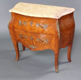 A French inlaid Kingwood commode of bombe form with pink veined marble top, fitted 2 long drawers with gilt metal mounts throughout 76cm x 82cm x 41cm 
