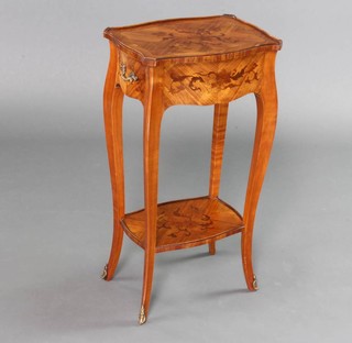 An inlaid and crossbanded 2 tier lamp table with quarter veneered top of serpentine form, fitted a brushing slide and drawer, raised on cabriole supports 68cm h x 36cm w x 27cm d 