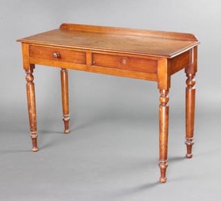 A Victorian mahogany side table with raised back, fitted 2 drawers raised on turned supports 75cm h x 101cm w x 42cm d 
