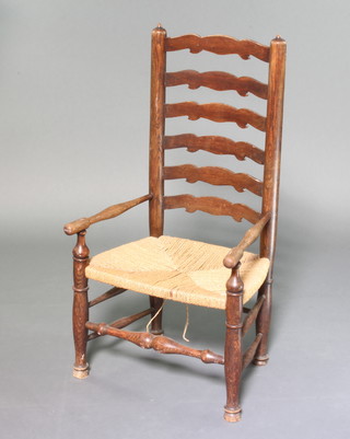 An 18th/19th Century elm ladder back  carver chair  with woven seat  