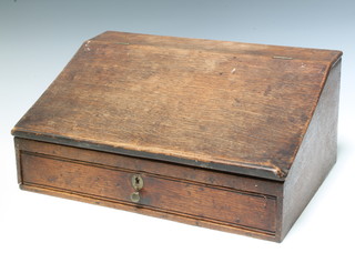 An 18th/19th Century elm clerk's slope, the base fitted a drawer 21cm h x 47cm w x 32cm d 