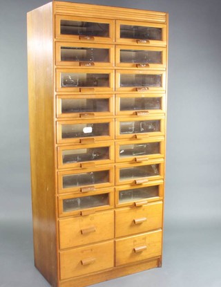 An oak drapers chest fitted 20 shallow drawers 200cm h x 90cm w x 20cm d 