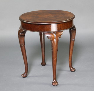 A Queen Anne style circular figured walnut occasional table with quarter veneered top, raised on cabriole supports 60cm h x 53cm diam. 