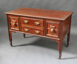 An Edwardian carved walnut dressing table, the base fitted 2 long drawers flanked by 2 short drawers raised on square supports 77cm h x 123cm w x 61cm d  