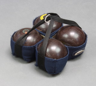 A set of 4 Hemselit standard bowling woods complete with carrying case