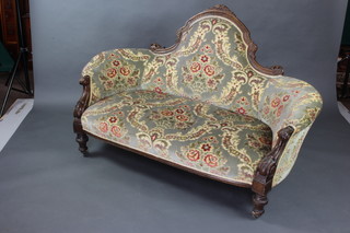 A Victorian 6 piece carved walnut drawing room suite comprising shaped sofa, open arm chair and 4 salon chairs, upholstered in sculpted floral dralon, raised on turned and fluted supports  