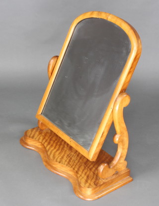 A Victorian arched plate dressing table mirror contained in a bleached mahogany frame, the base of serpentine outline 71cm h x 60cm w x 29cm d 