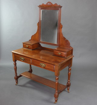 A Victorian walnut dressing table with rectangular plate mirror, the base fitted 2 glove drawers and 2 long drawers and undertier, raised on turned and block supports 163cm h x 106cm w x 50cm d 